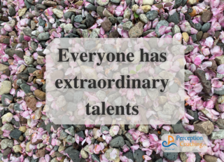 Everyone has extraordinary talents. Background: small pink flowers on gravel.